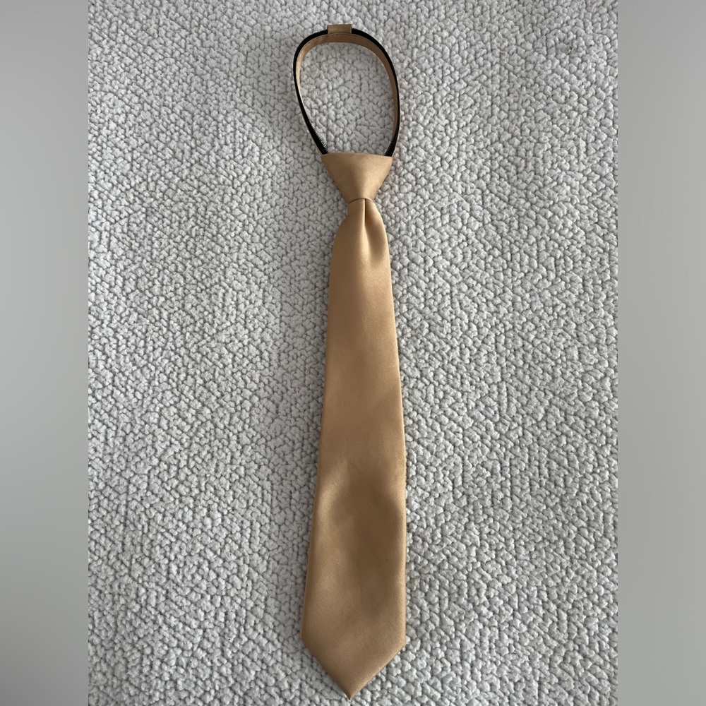 Zip up tie, gold kids size large.
